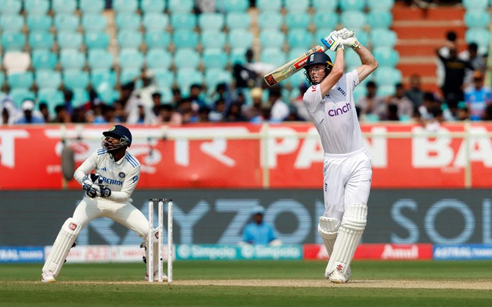 England's Zak Crawley takes a shot off the bowling of India's Axar Patel