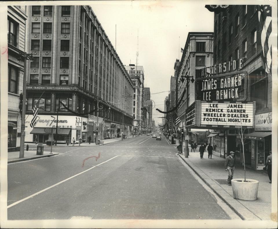 West Wisconsin Avenue is nearly empty on Nov. 25, 1963, with many Milwaukeeans were home watching the televised funeral of President John F. Kennedy, who had been assassinated three days earlier. This photo looks west down Wisconsin Avenue from the Milwaukee River.