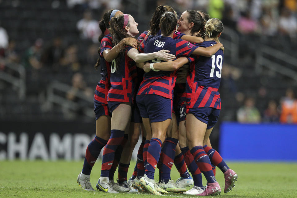 United States' Alex Morgan is congratulated after scoring her side's opening goal from the penalty spot against Canada during the CONCACAF Women's Championship final soccer match in Monterrey, Mexico, Monday, July 18, 2022. (AP Photo/Roberto Martinez)