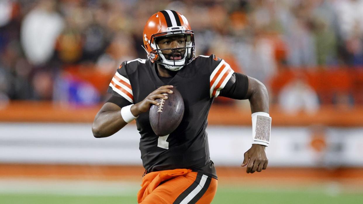 Cleveland Browns quarterback Jacoby Brissett scrambles for a short gain.