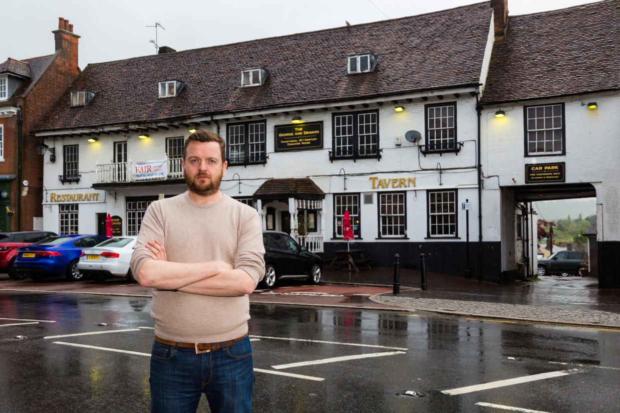 **PICTURE RELEASED FOR SUNDAY PRINT MEDIA - ONLINE EMBARGO UNTIL 6.00AM / SUNDAY 12 MAY, 2019**  Pub landlord Patrick Trenter, 38, at his pub the George and Dragon in Westerham, Kent. See SWNS story SWSYfarage. Former UKIP leader Nigel Farage has been banned from his local pub after he allegedly made a swift exit when he was involved in a head on crash with the landlord. Patrick Tranter, 38, was driving home with his one-year-old son when his Jaguar was hit by Farage's Range Rover, he claims. But instead of checking on Patrick and his son, the Eurosceptic MEP is said to have fled the scene. Patrick and his shaken baby son George were taken to hospital in an ambulance, and he claims his car has been written off. 