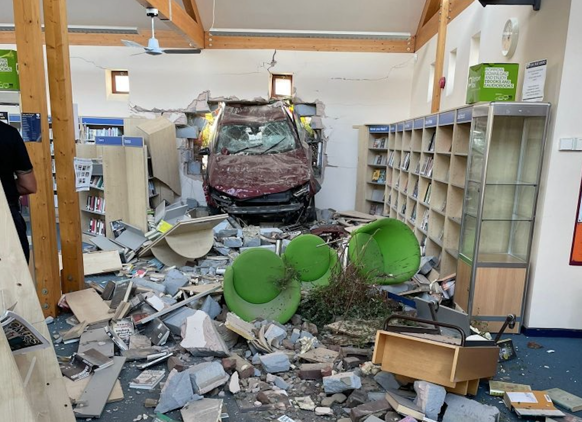 Emergency services were called after a car ploughed through the wall of a library in Hardley, Hampshire. (Hampshire & Isle of Wight Fire & Rescue Service)