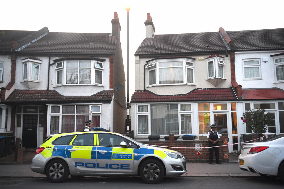 Police at the scene in Raymead Avenue, Croydon, where a woman who was eight months pregnant was been stabbed to death (Picture: PA)