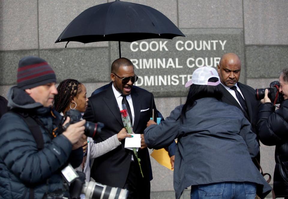 R Kelly in 2019 leaving a hearing for his sex abuse case in Chicago, Illinois (AFP via Getty Images)