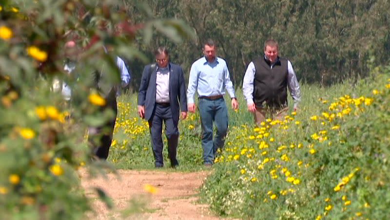 Franz Kolb, the director of international trade and diplomacy for the Governor’s Office of Economic Opportunity, center, Rep. Casey Snider, R-Paradise, and Kelly Pehrson, deputy director of the Utah Department of Agriculture and Food, walk in a field near the Center for Water Sensitive Cities in Tel Aviv, Israel, on Monday, March 27, 2023.