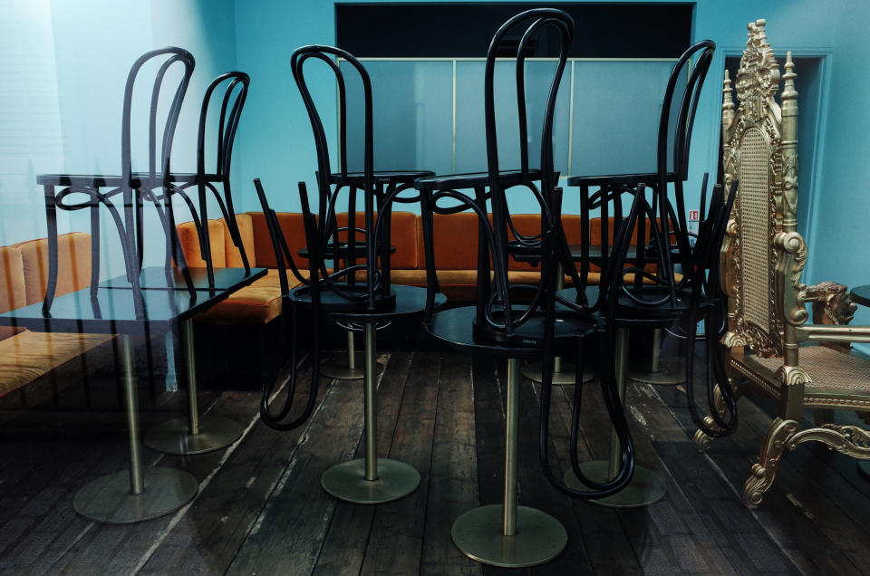 Chairs stand on tables in the cafe section of a closed bakery on Kingly Street in the hospitality and nightlife hotspot of Soho in London, England, on March 21, 2020. Much of central London was virtually empty today, a day after British Prime Minister Boris Johnson ordered the closure of all pubs, bars, cafes and restaurants around the country. The move represents a toughening of measures to enforce the 'social distancing' that is being urged on citizens to reduce the growth of covid-19 coronavirus infections. Nightclubs, theatres, cinemas, gyms and leisure centres were also ordered closed. Some shops in the centre of capital remained open today, albeit mostly deserted of customers; many retailers however have temporarily closed their doors until the crisis abates. (Photo by David Cliff/NurPhoto via Getty Images)