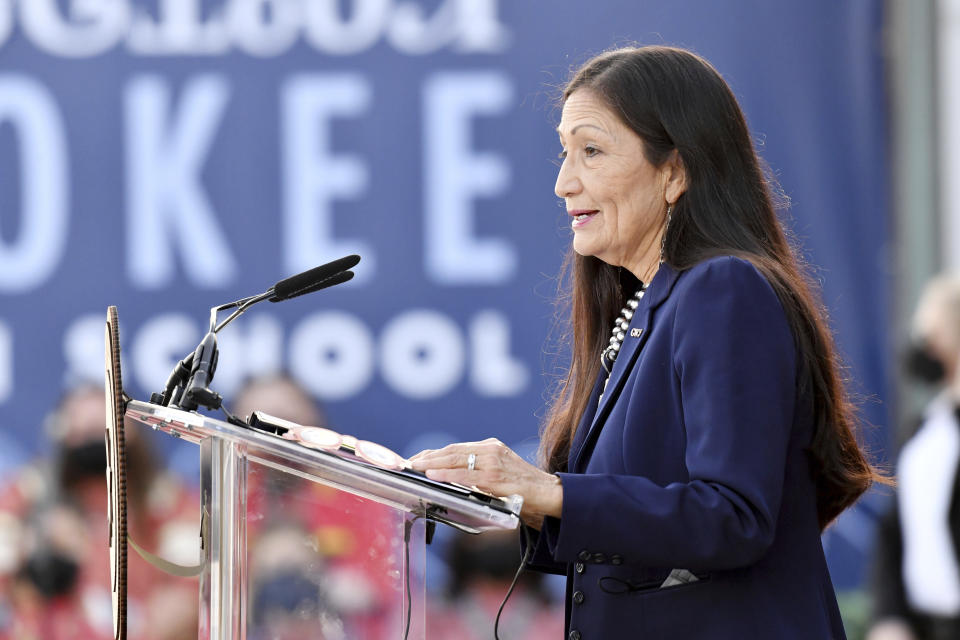 FILE - Interior Secretary Deb Haaland speaks at the Cherokee Immersion School on Dec. 3, 2021, in Tahlequah, Okla. The Interior Department is on the verge of releasing a report on its investigation into the federal government's past oversight of Native American boarding schools. Interior Secretary Deb Haaland said Wednesday, March 16, 2022, the report will come out next month. (AP Photo/Michael Woods, File)