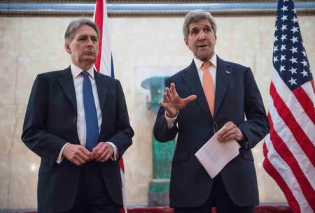 U.S. Secretary of State John Kerry (R) and Britain's Foreign Secretary Philip Hammond address the media at the donors Conference for Syria in London, Britain February 4, 2016. REUTERS/Nicholas Kamm/pool