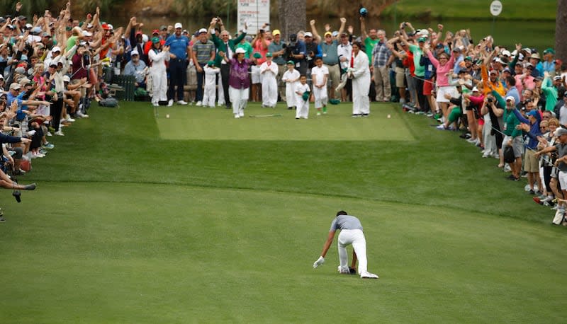 Tony Finau twists his ankle after reacting to his hole-in-one on the seventh hole during the Par-3 Contest at the Masters Wednesday, April 4, 2018, in Augusta, Ga. The Utah native is back at Augusta this week looking to win his first green jacket. | Charlie Riedel, Associated Press