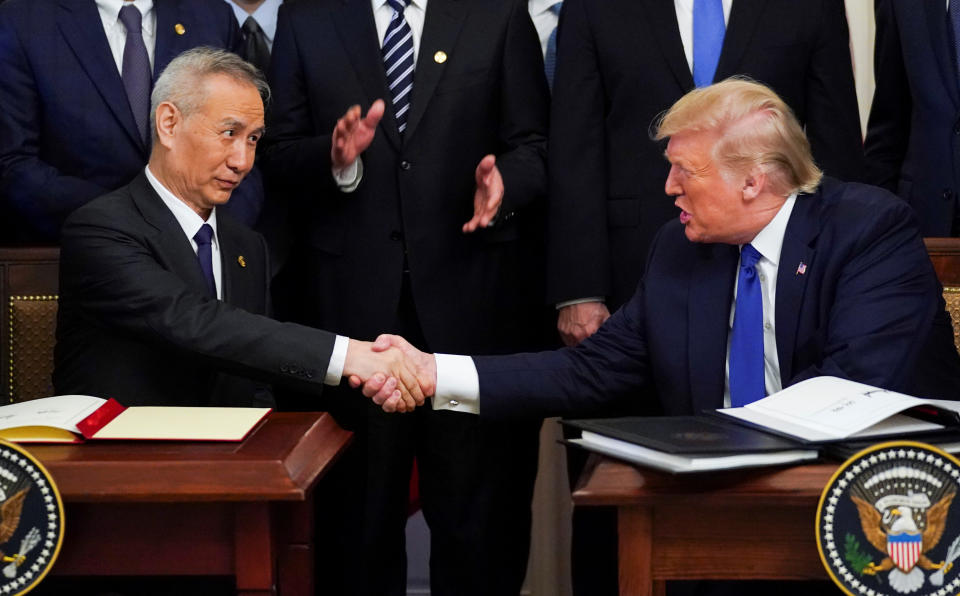 Chinese Vice Premier Liu He and U.S. President Donald Trump shake hands after signing "phase one" of the U.S.-China trade agreement during a ceremony in the East Room of the White House in Washington, U.S., January 15, 2020. REUTERS/Kevin Lamarque