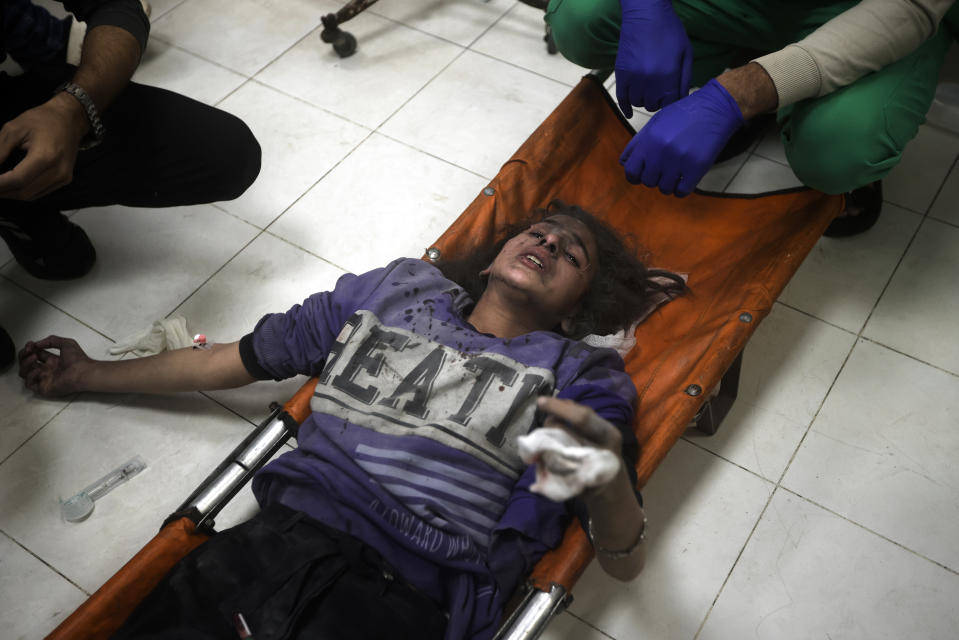A Palestinian girl wounded in the Israeli bombardment of the Gaza Strip receives treatment at the Nasser hospital in Khan Younis, Southern Gaza Strip, Tuesday, Jan. 2, 2024. (AP Photo/Mohammed Dahman)