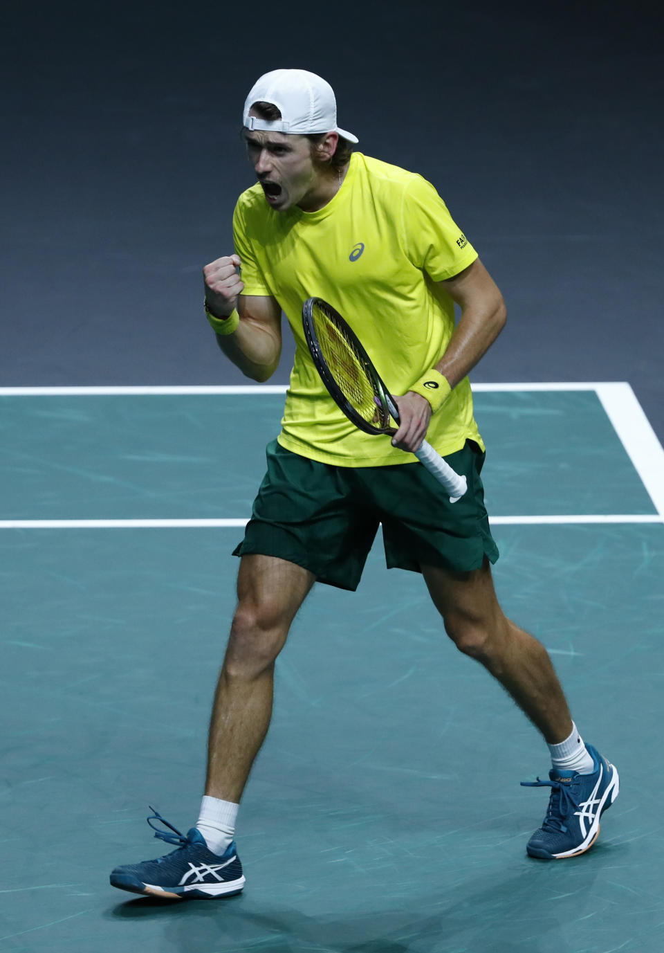 Australia's Alex de Minaur celebrates after defeating Netherland's Botic van de Zandschulp during a Davis Cup quarter-final tennis match between Australia and The Netherlands in Malaga, Spain, Tuesday, Nov. 22, 2022. (AP Photo/Joan Monfort)