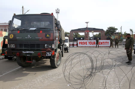 An Indian army vehicle moves outside their camp after suspected militants attacked the camp on Saturday, in Jammu February 11, 2018. REUTERS/Mukesh Gupta