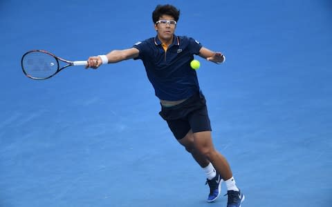 South Korea's Hyeon Chung hits a return against Germany's Alexander Zverev during their men's singles third round match on day six of the Australian Open tennis tournament in Melbourne on January 20, 2018 - Credit: AFP 
