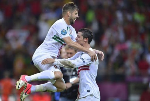 Portuguese forward Cristiano Ronaldo (R) and midfielder Miguel Veloso celebrate after winning the Euro 2012 football championships quarter-final match between the Czech Republic and Portugal at the National Stadium in Warsaw. Ronaldo was the hero as Portugal beat an ultra-defensive Czech Republic 1-0