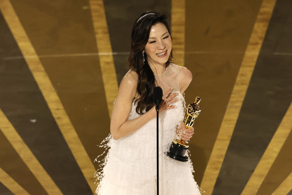 Michelle Yeoh accepts the Best Actress award for Everything Everywhere All at Once during the Academy Awards on March 12.
