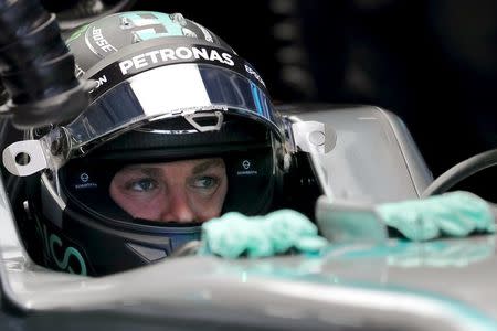 Formula One - Chinese F1 Grand Prix - Shanghai, China - 17/4/16 - Mercedes driver Nico Rosberg of Germany sits in his car before Chinese Grand Prix. REUTERS/Pool