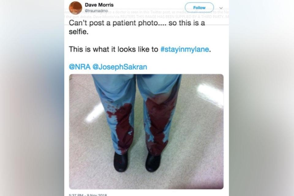 One doctor posted a selfie showing his blood-stained scrubs after carrying out emergency surgery on a gun victim