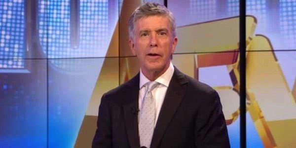 Tom Bergeron stands in front of the AFV screens