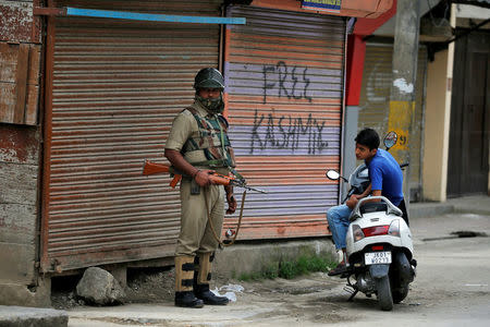 Pro-independence graffiti is sprayed on a shop shutter in Srinagar, Kashmir, India May 21, 2017. REUTERS/Cathal McNaughton