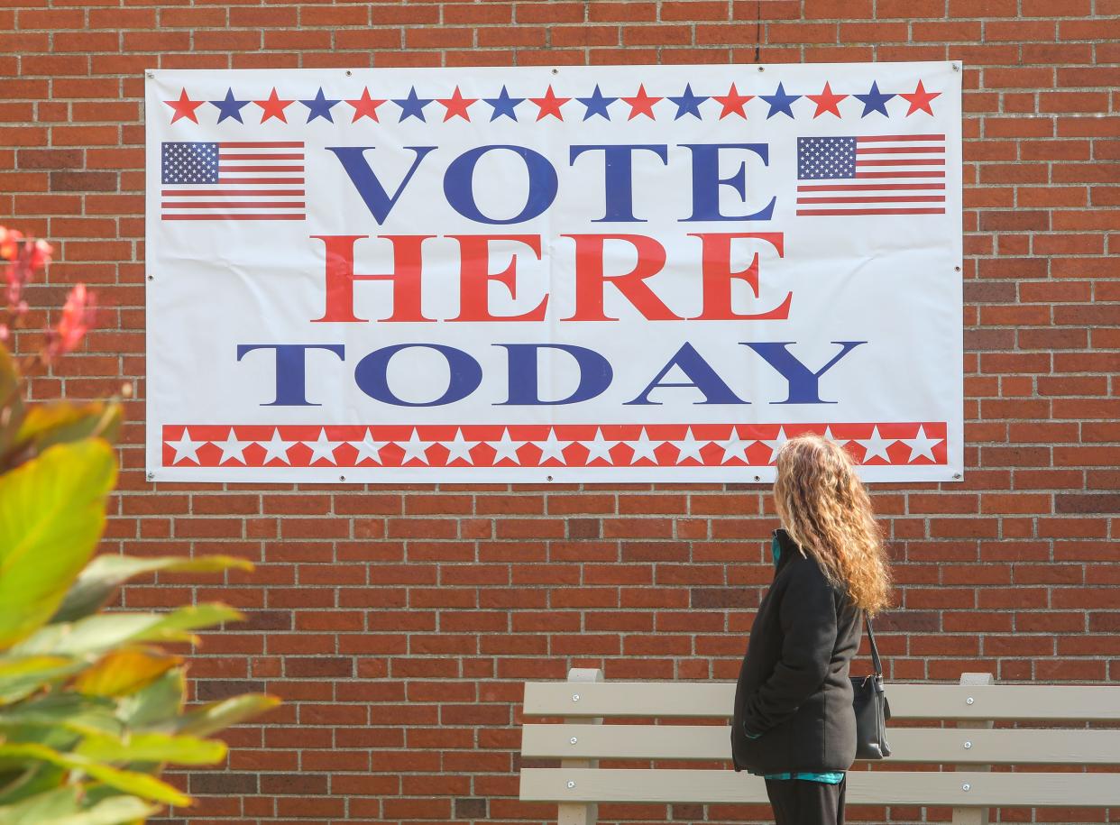 A banner announcing “Vote Here Today” hangs outside the Portage County Board of Elections offices in Ravenna.