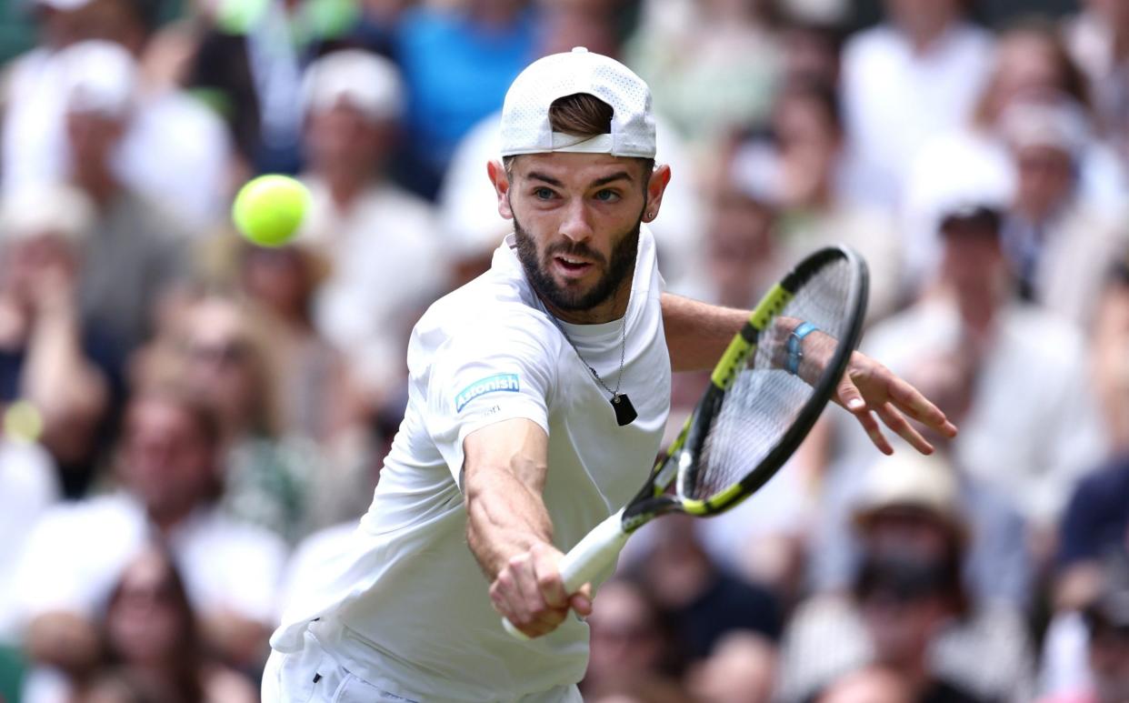 Jacob Fearnley in action against Novak Djokovic