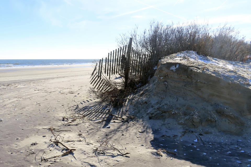 FILE - This Jan. 22, 2024, photo shows a severely eroded section of sand dune in North Wildwood N.J. On April 25, 2024, North Wildwood and the state of New Jersey announced an agreement for an emergency beach replenishment project there to protect the city until a full-blown beach fill can be done by the U.S. Army Corps of Engineers that may still be two years away. Winter storms punched a hole through what is left of the city's eroded dune system, leaving it more vulnerable than ever to destructive flooding. (AP Photo/Wayne Parry, File)