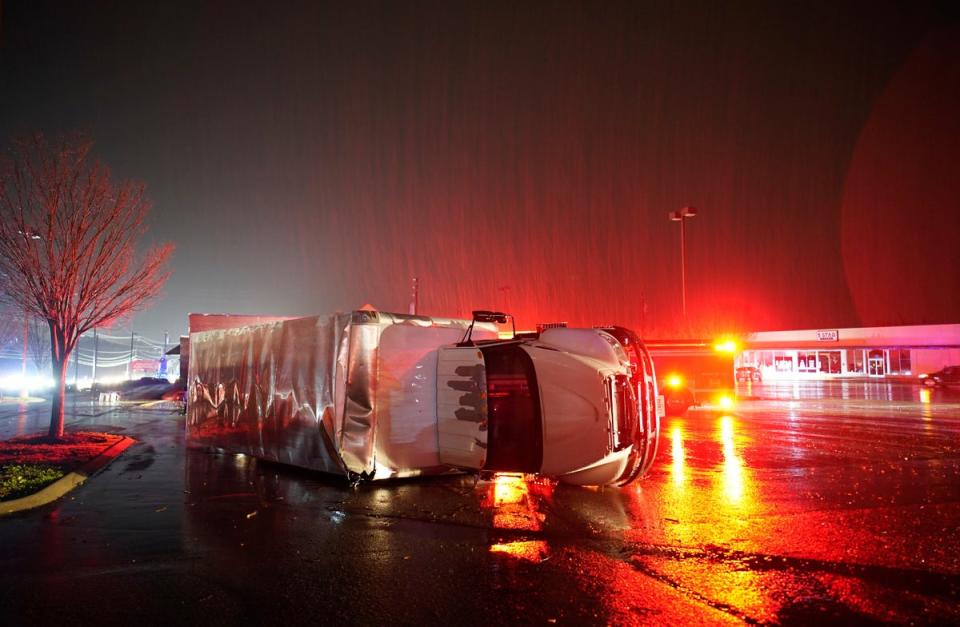 A semitrailer is overturned by an apparent tornado on West Main Street in Hendersonville, Tennessee (THE TENNESSEAN)