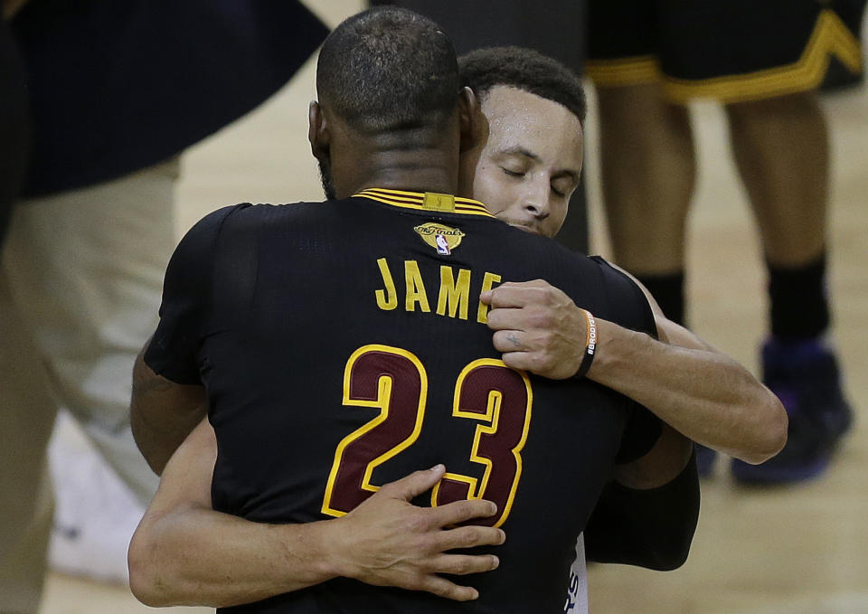 LeBron James embraces the Warriors. (AP)