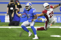 Detroit Lions running back Godwin Igwebuike (35) outruns Arizona Cardinals inside linebacker Zaven Collins (25) during the first half of an NFL football game, Sunday, Dec. 19, 2021, in Detroit. (AP Photo/Lon Horwedel)