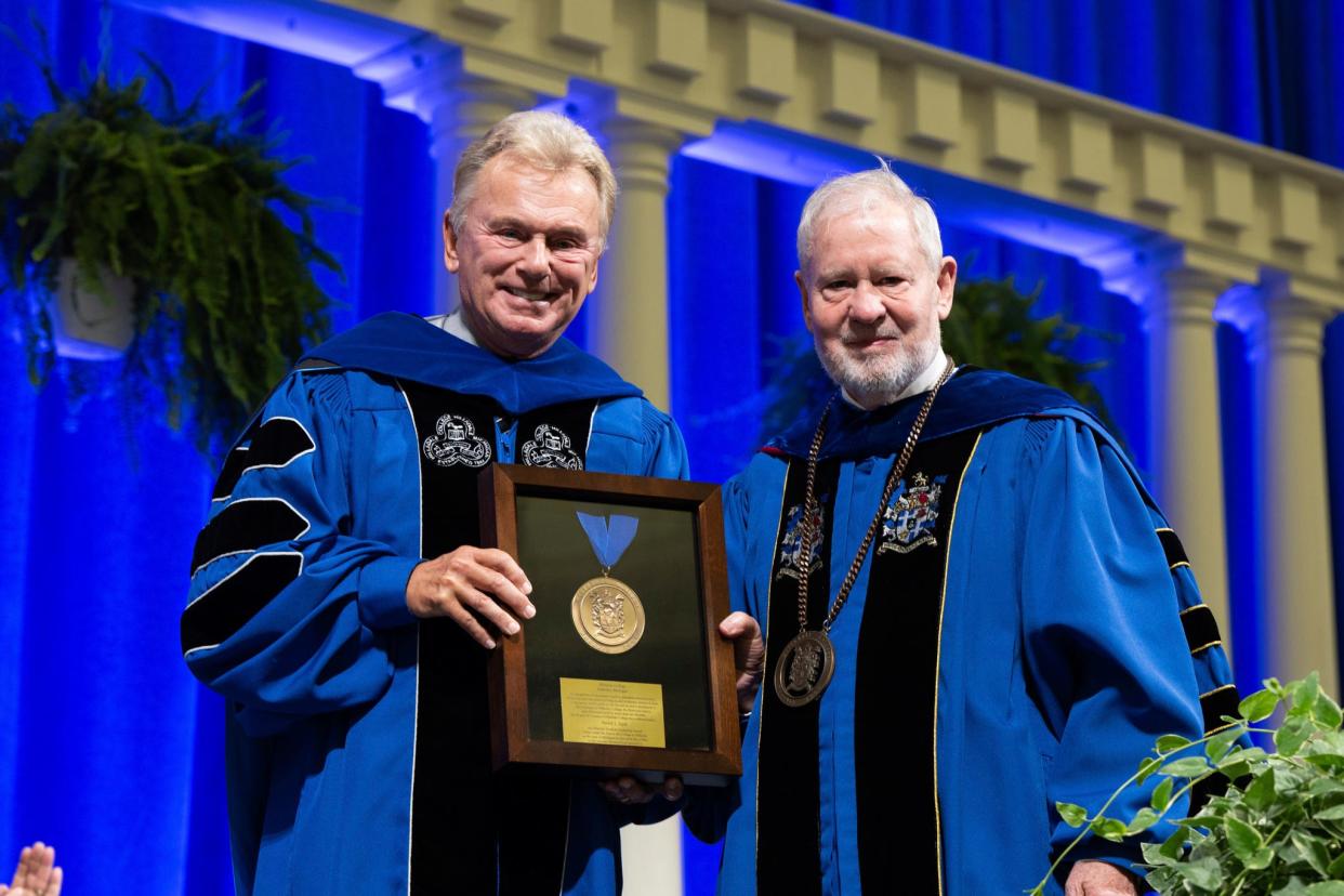 Hillsdale College board of trustees chairman Pat Sajak, left, poses for a photograph with Hillsdale College President Larry Arnn May 11.