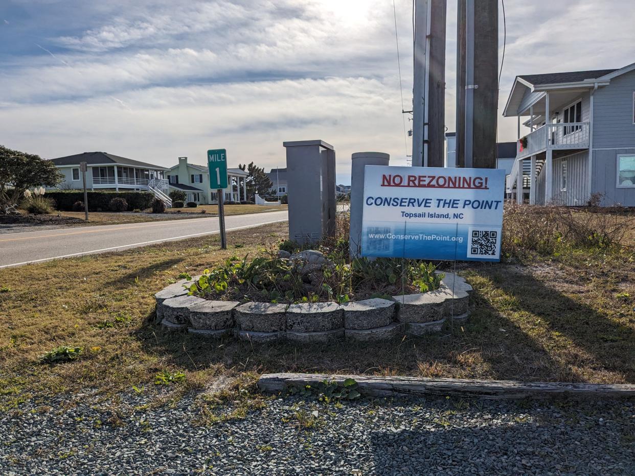 A sign urging "The Point" to stay undeveloped seen along the main drag in Topsail Beach in late November.