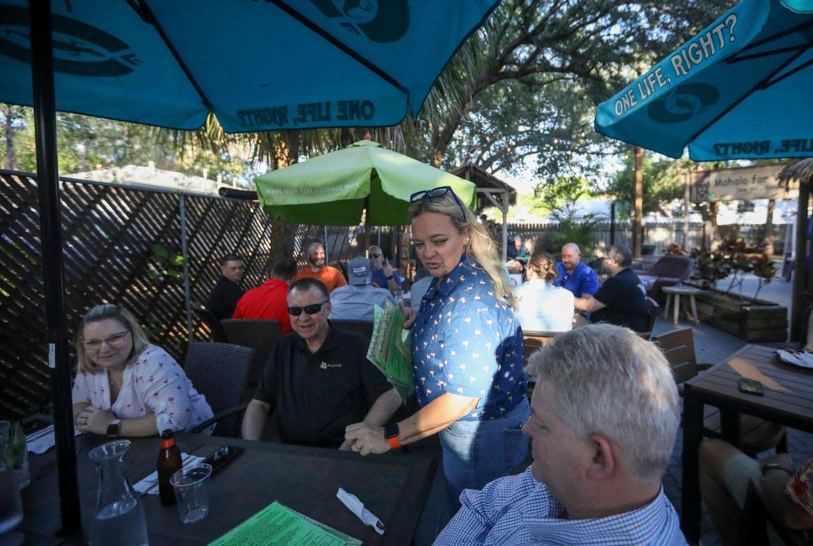 Kimberly Platt, chef and owner of The Honu, a tiki-themed bar and restaurant, attends to guests Thursday, April 20, 2023 in Dunedin. Platt is one of the organizers of this year&#x002019;s Dunedin Pride event.