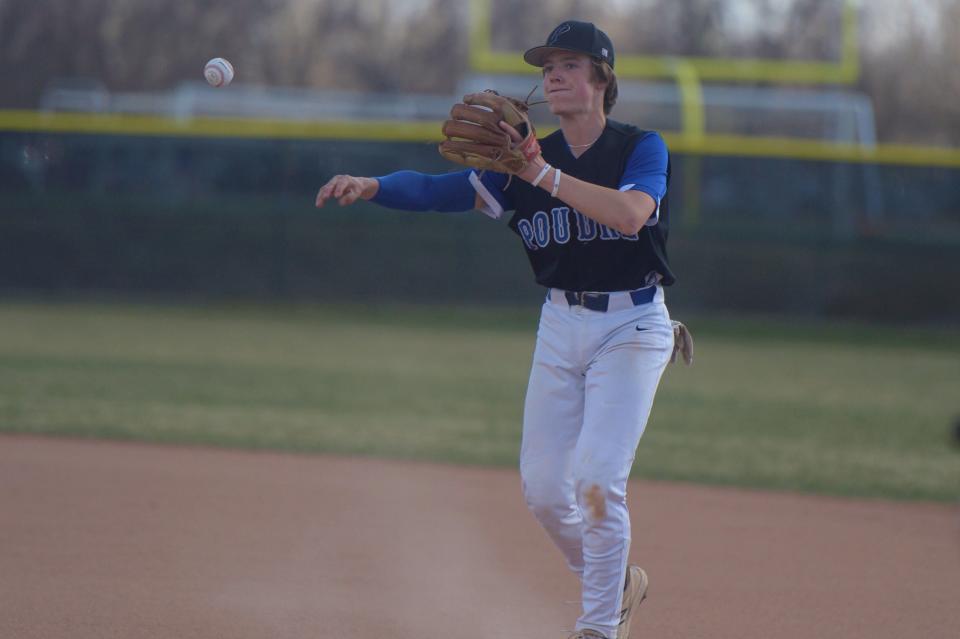 Poudre baseball player Ryan Vandever throws to first during a game against Fort Collins on April 14, 2022. Poudre won 8-5.