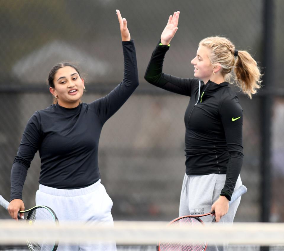 Hoover doubles team Nyla Spangler and Bridget Fink celebrate a point against Jackson's Anisha Rawal and Isha Nagajothi in the Division I sectional semifinals at Jackson Park Courts, Saturday, Oct. 7, 2023.