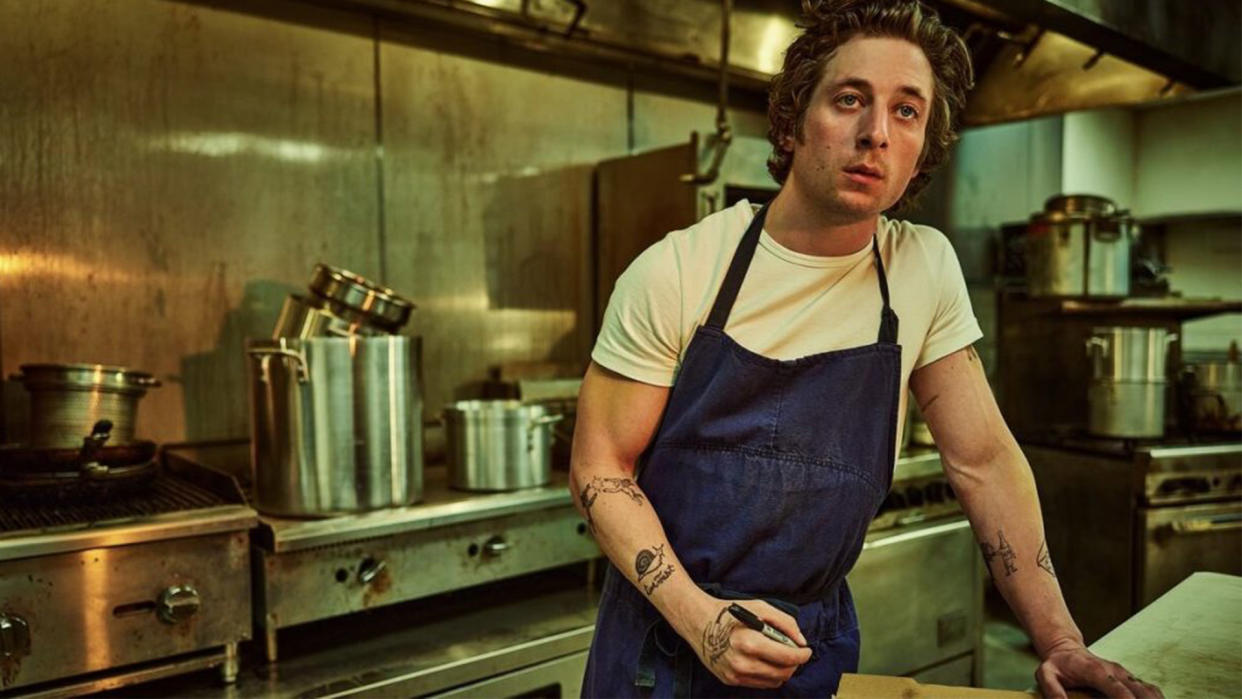  Jeremy Allen White stands in a kitchen in the Bear season 3. 