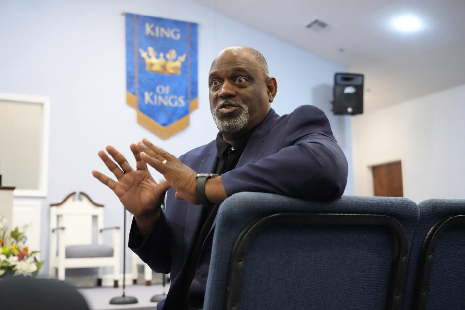 The Rev. Ricky Sutton sits in the nave of his Mount Carmel Ministries church during an interview in Pearl, Miss., Friday, Aug. 4, 2023. Six white former Mississippi law enforcement officers pled guilty Thursday to federal civil rights offenses against two Black men who were brutalized during a home raid that ended when an officer shot one of the men in the mouth. Sutton says racism runs so deep in Rankin County that some Black people are afraid to spend time there. (AP Photo/Rogelio V. Solis)