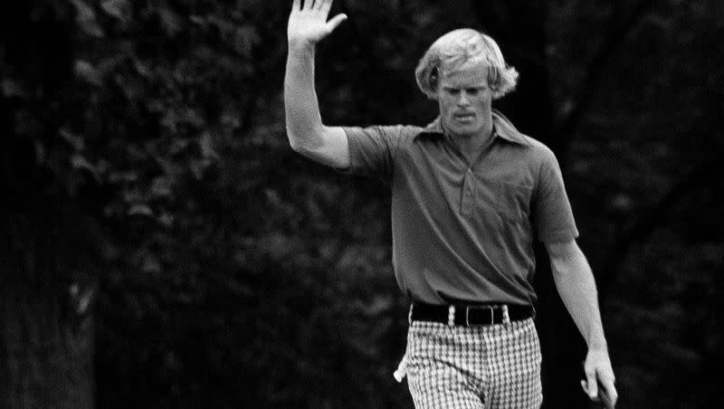 Johnny Miller, who started his final U.S. Open round Sunday, June 17, 1973, six strokes behind the leaders and 3-over-par 216, takes over fourth-round lead with a charging 5-under par by birdie on the 15th, where he raises his hand after sinking the putt in Oakmont, Pa. The former BYU great will be honored by the USGA this summer to commemorate the 50th anniversary of historic comeback victory.