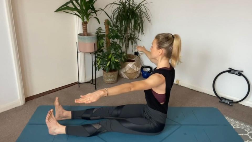 Pilates spine twist exercise