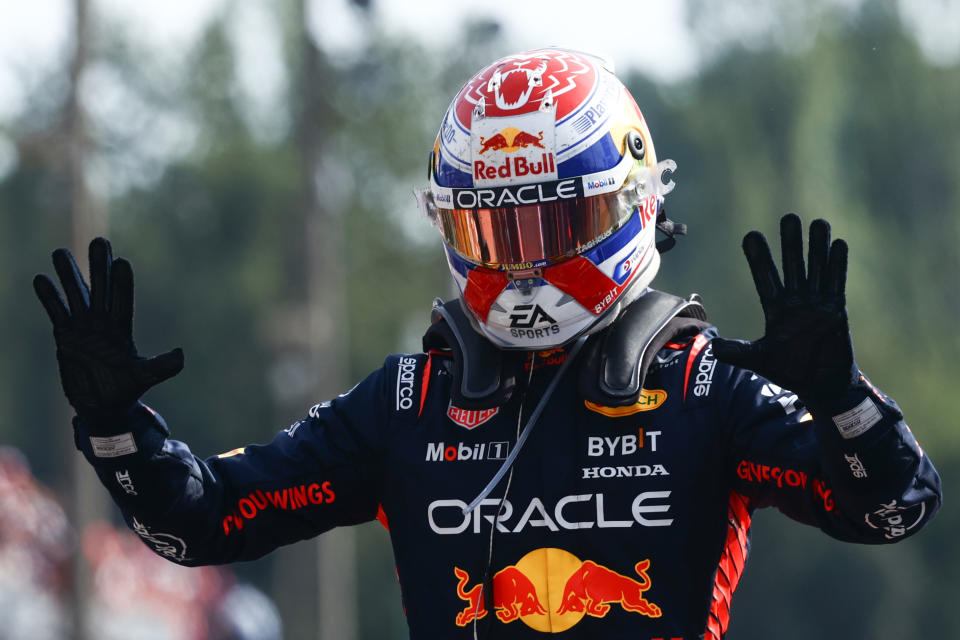 Max Verstappen holding up 10 fingers - indicating how many races he had won in a row - after clinching the Italian Grand Prix. 