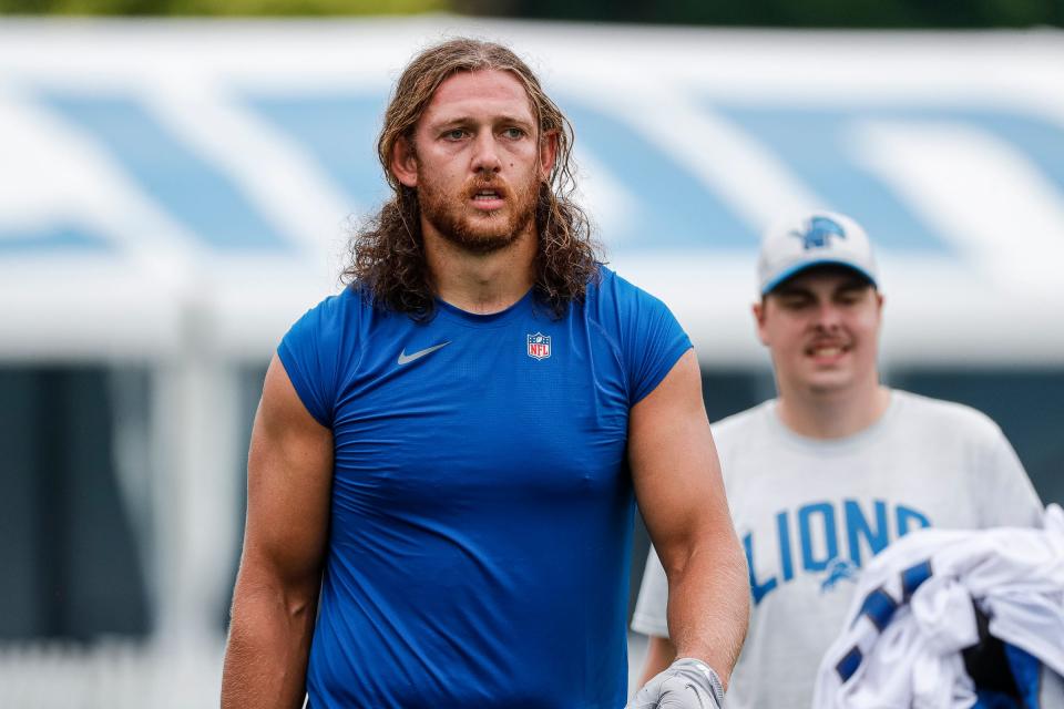 Lions tight end T.J. Hockenson walks off the field after practice during the first day of training camp July 27, 2022 in Allen Park.