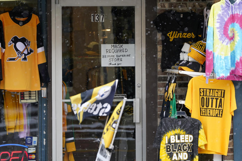 A sign requiring patrons to wear a mask is on the door to Whitey's General Store in Zelienople, Pa., Thursday, Jan. 28, 2021. Irritated by the sweeping use of executive orders during the COVID-19 crisis, state lawmakers around the U.S. are moving to curb the authority of governors and top health officials to impose emergency restrictions such as mask rules and business shutdowns. (AP Photo/Keith Srakocic)