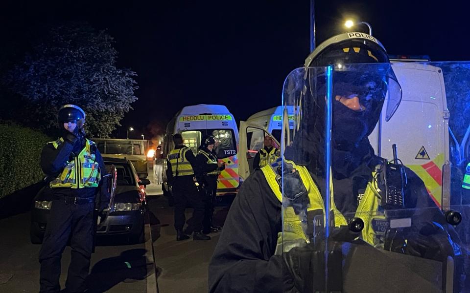 Riot police attend the disorder - Bronwen Weatherby/PA 