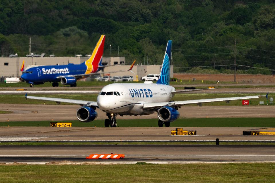 A United Airlines flight taxis in front of a Southwest Airlines flight at Nashville International Airport in Nashville, Tenn., Tuesday, April 23, 2024.
