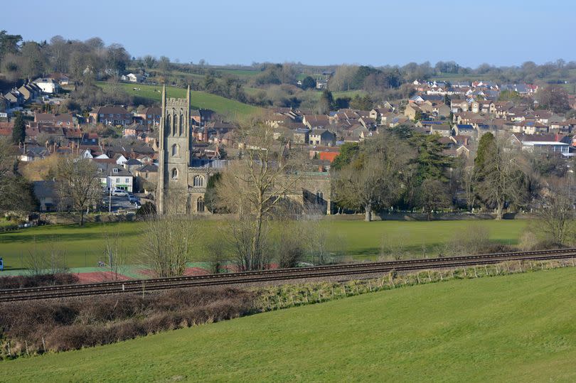 Bruton, Somerset, England - view to town and church from the dovecote, with railway tracks in foreground