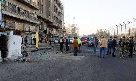 Iraqi security forces inspect the site of a bomb attack in Baghdad, Iraq January 15, 2018. REUTERS/Khalid al Mousily