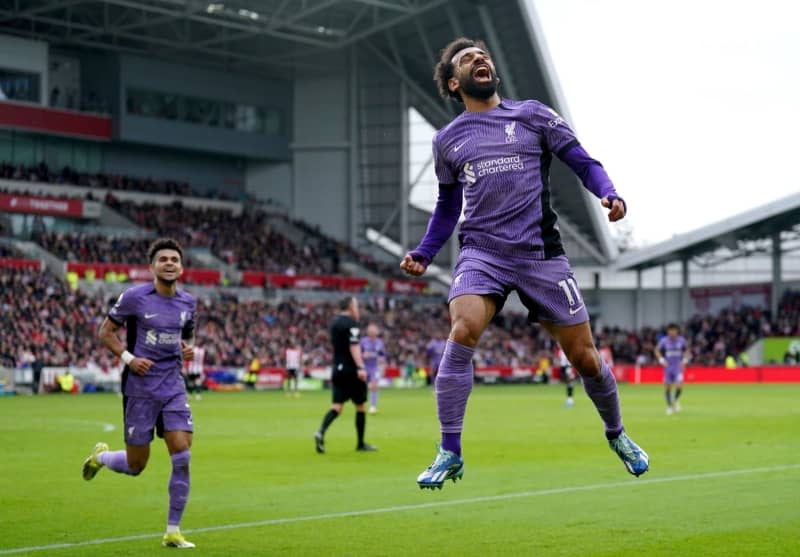 Liverpool's Mohamed Salah celebrates scoring his side's third goal during the English Premier League soccer match between Brentford and Liverpool at the Gtech Community Stadium. Adam Davy/PA Wire/dpa