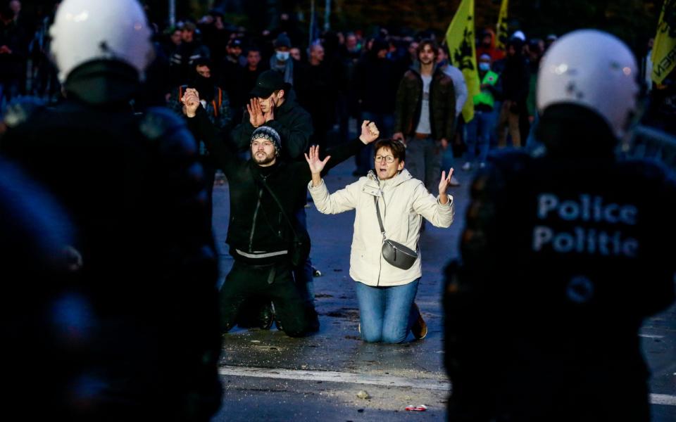 Protesters face riot place clash during an anti-coronavirus measures protest - STEPHANIE LECOCQ/Shutterstock