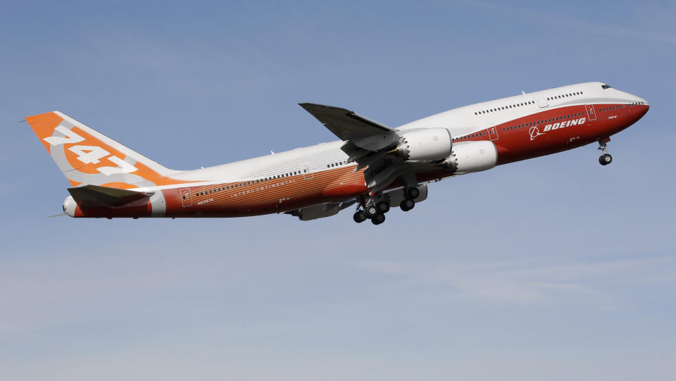 FILE - A Boeing 747-8, Boeing's new passenger plane, takes its first flight, Sunday, March 20, 2011, at Paine Field in Everett, Wash. After more than half a century, Boeing is rolling its last 747 out of a Washington state factory on Tuesday night. (AP Photo/Ted S. Warren, File)