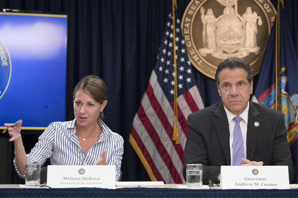 FILE — Secretary to the Governor Melissa DeRosa, answers questions with Gov. Andrew Cuomo, during a news conference, Friday, Sept. 14, 2018, in New York. DeRosa resigned Sunday, Aug. 8, 2021, a week after a report found the governor sexually harassed 11 women. (AP Photo/Mary Altaffer, File)